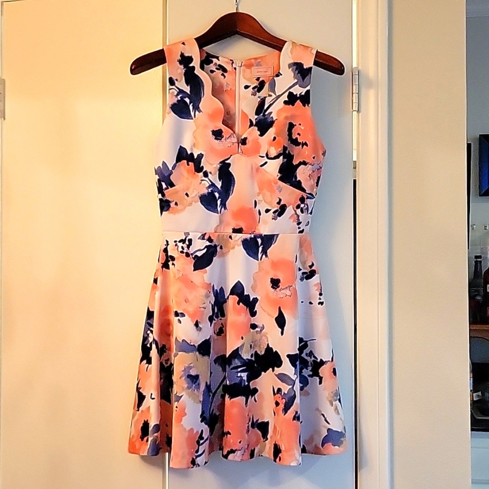 Polyester floral sleeve less dress .it's short .